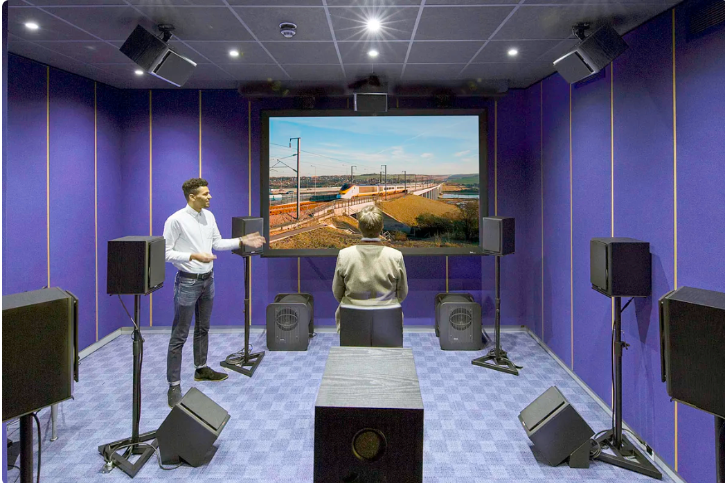 Illustrative sound lab demonstration with a rail simulation on screen